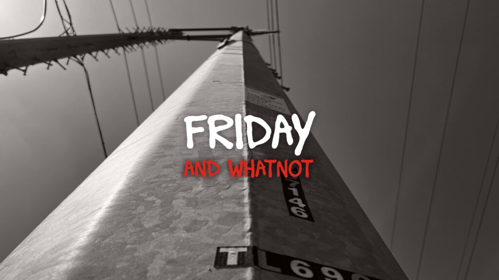 Friday and whatnot in Basquiat font over a black and white power pole
